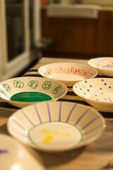 young boy artist painting ceramics