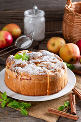 Fresh sponge cake. Chiffon biscuit with apples on table