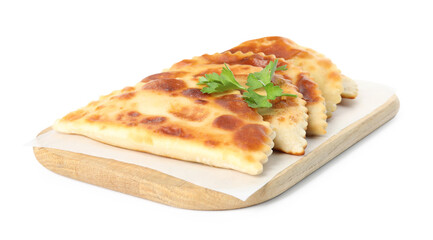 Board with delicious fried chebureki and parsley isolated on white