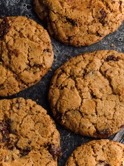 chocolate chip cookies on a stone surface