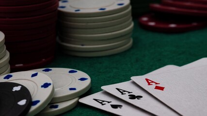 stop motion animation of green poker game table with poker chips and four aces shown on the table