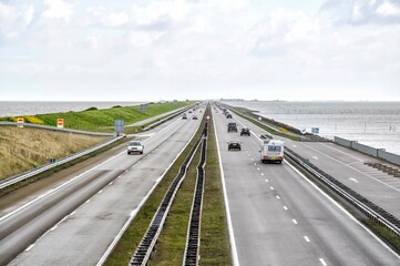 The Afsluitdijk is a major landmark (or a watermark, if you will) in the Netherlands. The dike was completed in 1933 and leads you in 32 km from Den Oever in North Holland to the province Friesland
