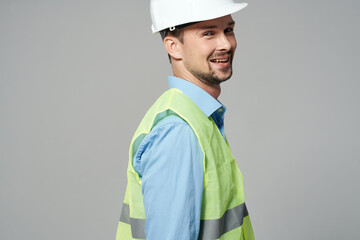 Man in a white helmet engineer safety isolated background