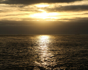 Image of Beautiful view of the golden sunset sky over the ocean printed on Printed Glass Basin Splashbacks