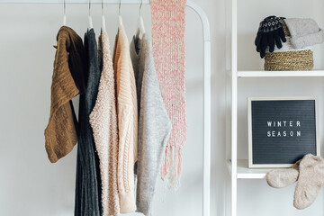 Winter clothes and accessories on hanger