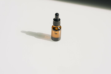 Unbranded bottles in mockup style with shadow top view. Tube of eye oil on a white background....