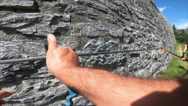 Via Ferrata from Murren to Gimmelwald. Risky rock climbing on Swiss Alps.