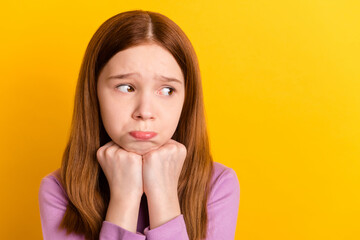 Photo of young unhappy upset lonely little girl look copyspace crying depressed isolated on yellow color background