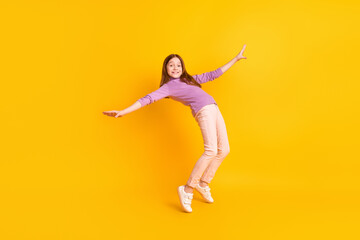 Fototapeta na wymiar Full size photo of happy excited positive smiling funky beautiful girl dancing fooling isolated on yellow color background