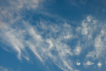 Scattered white clouds on blue sky.
