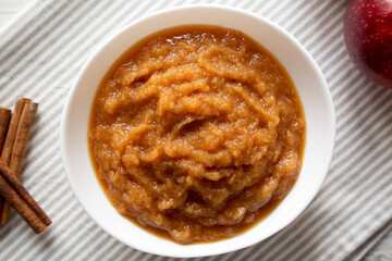 Homemade Raw Apple Sauce in a White Bowl, top view. From above, flat lay, overhead. Close-up.