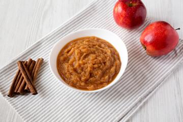 Homemade Raw Apple Sauce in a White Bowl, low angle view.