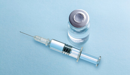 vaccine bottles and syringe