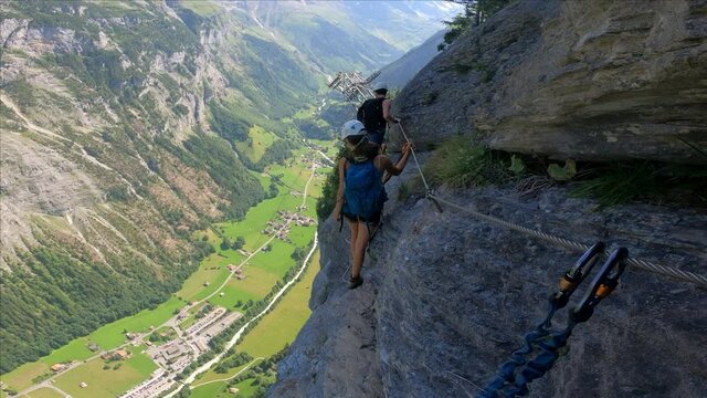 Via Ferrata from Murren to Gimmelwald. Risky rock climbing on Swiss Alps.