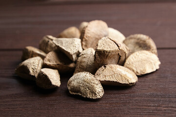 Brazil nuts or Bertholletia excelsa seeds on wooden table