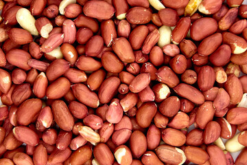 Peeled raw peanuts food background