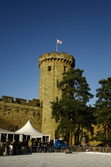 old British Castle in warwick westmidlands in golden autumn light with the blue sky background during autumn
