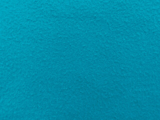 Fototapeta na wymiar Felt light blue soft rough textile material background texture close up,poker table,tennis ball,table cloth. Empty light blue fabric background.