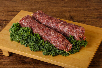 Raw minced beef kebab skewer