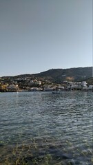 Fototapeta na wymiar Village in Greece.Greece coast and Greece bay with sails at sunset