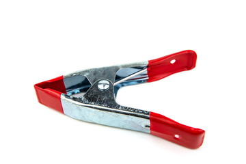 Metal clamp with rubber handle isolated on white background