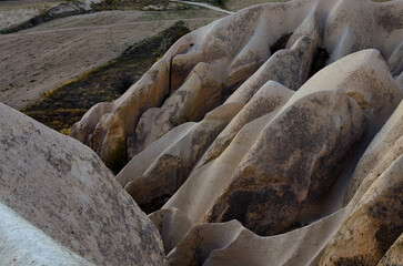 Detailed view of amazing shaped sandstone rocks. Typical geologic formations of Cappadocia. Abstract nature landscape. Famous touristic place and romantic travel destination in Turkey