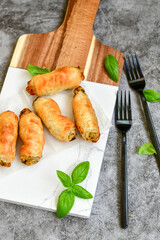  Greek style Mini filo pastry rolls with mushrooms.Home made bakery .Fresh baked  Mini cheese  ,meat and herbs puff pastries