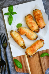  Greek style Mini filo pastry rolls with mushrooms.Home made bakery .Fresh baked  Mini cheese  ,meat and herbs puff pastries