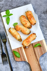  Greek style Mini filo pastry rolls with mushrooms.Home made bakery .Fresh baked  Mini cheese  ,meat and herbs puff pastries