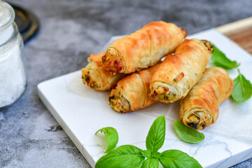  Greek style Mini filo pastry rolls with mushrooms.Home made bakery .Fresh baked  Mini cheese  ,meat and herbs puff pastries