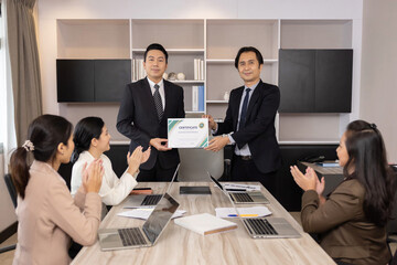 Businessman Receiving Certificate Award From His Boss in a Meeting