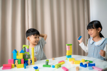 Childrens playing with colorful blocks together at home,Educational toys for child.