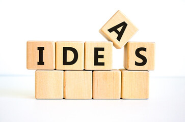 Ideas symbol. The concept word 'ideas' on wooden cubes on a beautiful white table. White background. Business and idea or ideas concept.