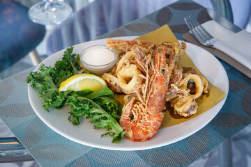 Dish of fried squid rings and shrimps, mediterranean food