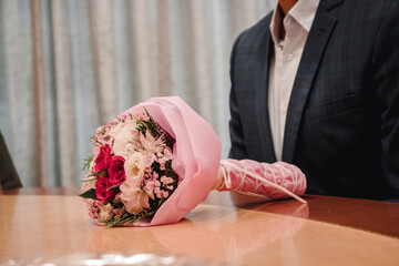 person with a bouquet of roses