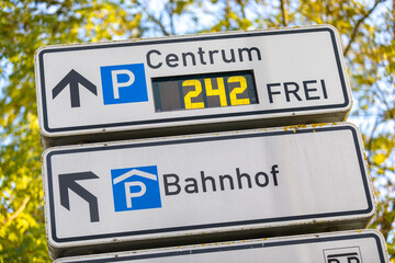 German parking garage sign. Bahnhof is the german word for train station. Frei is the german word for free.