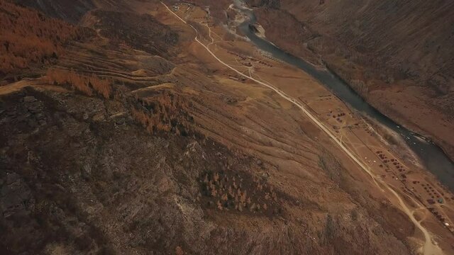 Katu Yaryk mountain pass in the valley of the Chulyshman River, Altai, Siberia, Russia. A huge stone gorge, a canyon, a mountain winding river, a dangerous serpentine highway. Freedom, loneliness