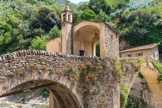 Badalucco - the arch bridge ( Santa Lucia Bridge) with chapel is the symbol of the small Ligurian village, Liguria, Italy