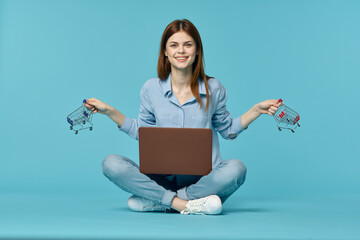 woman with laptop learning internet online education blue background