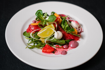 Salad with salmon, beets, lemon and herbs.