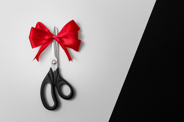 Scissors with red bow - obrazy, fototapety, plakaty