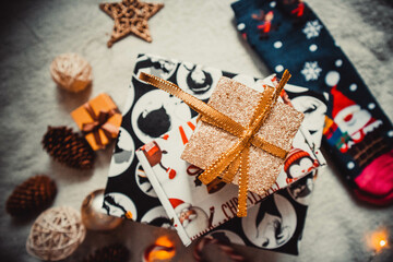 Christmas decorations and presents on the soft white plaid	