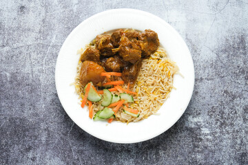 Selective focus picture of briyani rice serve with mutton insight . Famous Malaysia food usually...