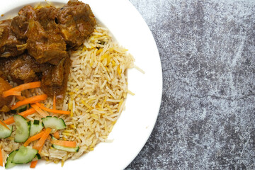 Selective focus picture of briyani rice serve with mutton insight . Famous Malaysia food usually serve during festive season and ceremony.