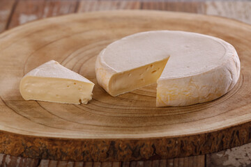 Reblochon cheese on a wooden background