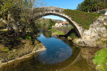Fototapeta na wymiar Aerial view of a scenic medieval bridge in Lierganes, Cantabria, Spain. High quality photo