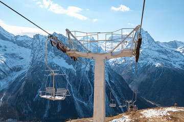 Dombay, alps, chairlift, ski lift, first snow in the mountains, sun and good weather, winter ski...