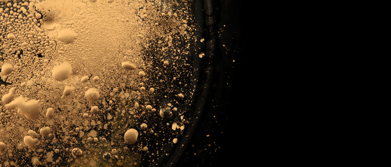 Macro Abstract bubble texture marble horizontal background. Acrylic gold and black color in water and oil.