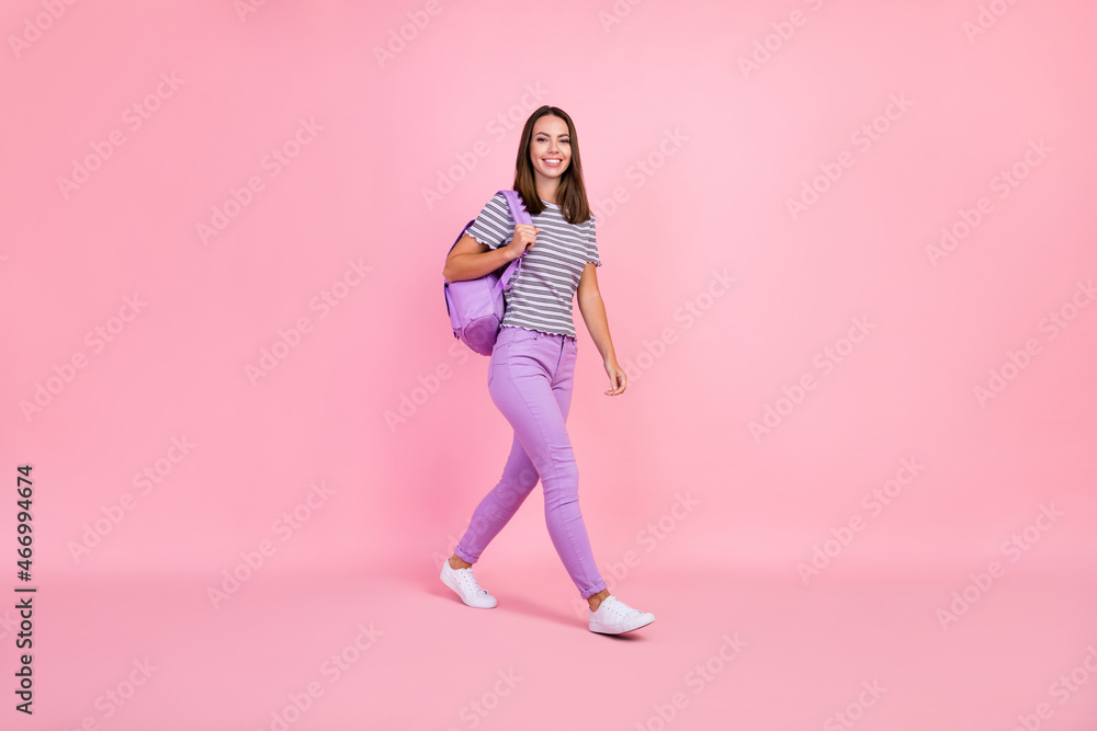 Canvas Prints photo of shiny charming young woman dressed striped clothes rucksack walking smiling isolated pink c