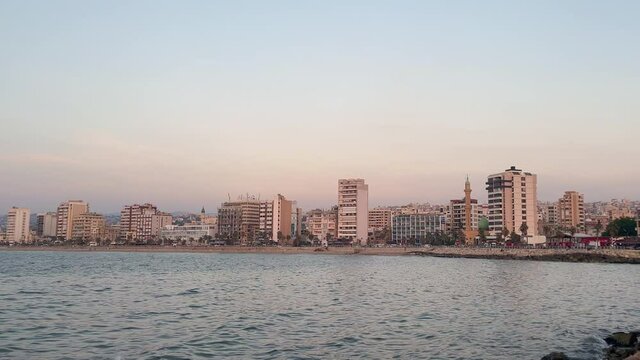 The city of Sidon in Lebanon. Sidon Sea Castle, built by the crusaders - Saida corniche and building. Sidon sea at sunset